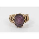 9ct gold amethyst cocktail ring in claw setting on pierced abstract design shank