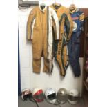 Three vintage motorcycle leathers together with a selection of motorcycle helmets