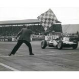 Group of approximately 20 1960's car and motorsport official press photographs to include Jim Clark,