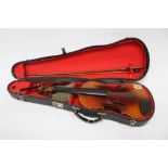 Two old violins in cases (one with bow)