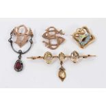 Group antique and later brooches to include two yellow metal monogram brooches, topaz three stone ba