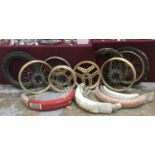 Lot of mixed motorcycle rims, tyres and mudguards
