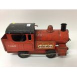 Tri-ang childs tin plate toy locomotive and a 1950s cuhilds toy lawnmower