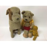Large mohair seated dog with glass eyes, a mohair teddy with plastic eyes and a small mohair bear( m