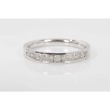 Diamond eternity ring with eleven round brilliant cut diamonds, weighing 0.33cts in total, in 9ct wh