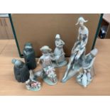 Four Lladro figures, boxed, two others and a Nao figure