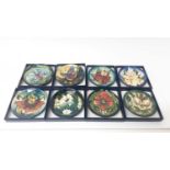Set of eleven Moorcroft pin dishes, various patterns, all boxed