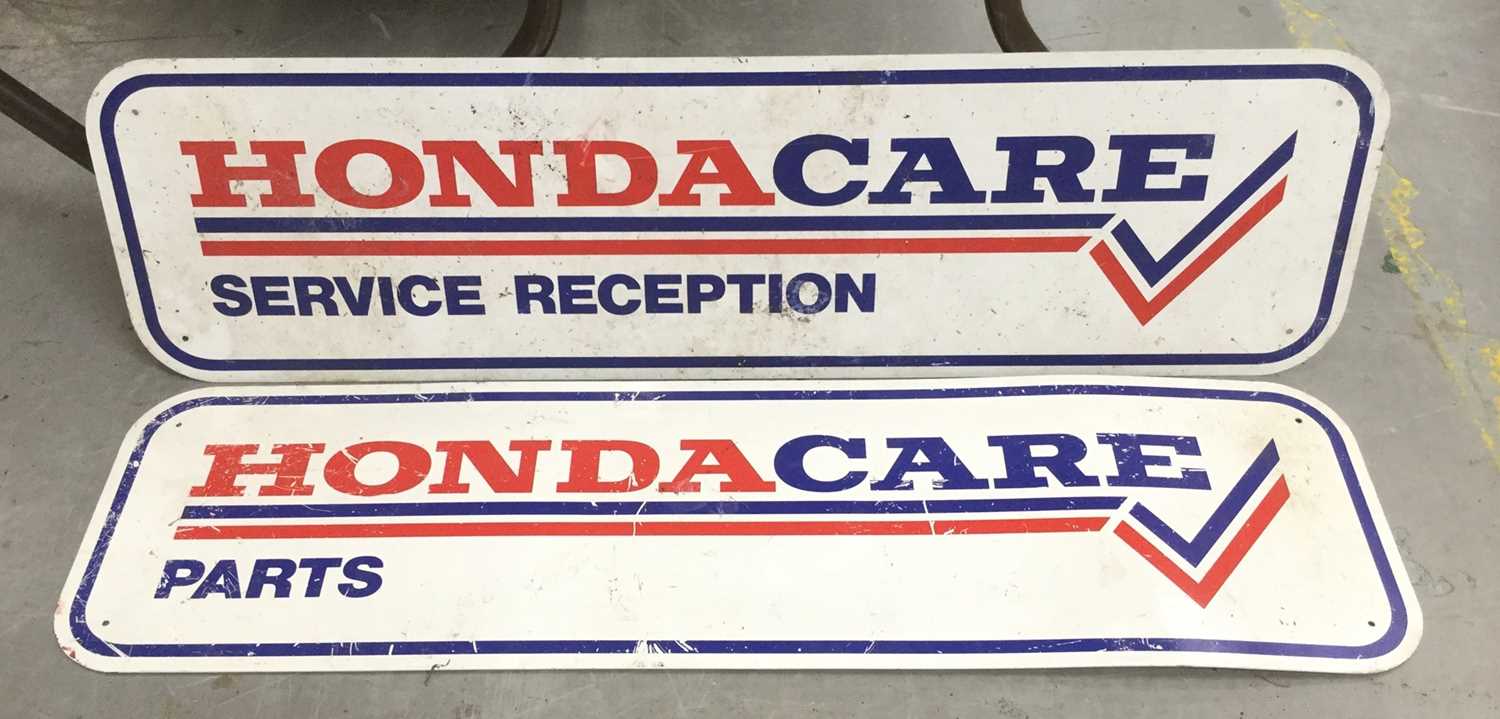 Pair of Honda Care Parts metal signs