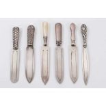 Six silver bookmarks in the form of knives including one with mother of pearl handle