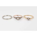 Two 18ct gold diamond single stone rings and an 18ct white gold wedding ring
