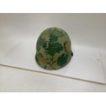 American Vietnam era M1 steel helmet, complete with camo cover, liner and chinstrap, the cover with