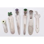 Six silver bookmarks to include three mounted with stones, enamelled shamrock, gem set heart and let