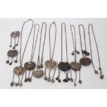 Collection of nine old Chinese silver/white metal pendant necklaces