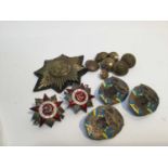 Group of British military brass buttons, together with Soviet military badges.