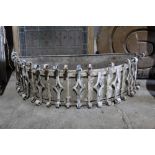 Wrought metal hemispherical planter, with liner and scrolling ornament, 93cm wide