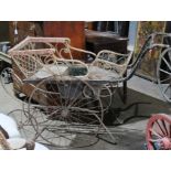 Late Victorian childs perambulator with wicker framed seating, iron wheels and two other childs wood