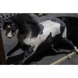 Old painted pine rocking horse with black hair mane and tail - sub frame lacking, approx 100 cm long