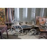 19th century childs four wheel buggy, blue painted frame with iron rimmed wooden wheels and folding