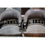 Pair of Victorian leather tub chairs, on turned legs and brass castors