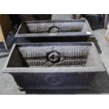 Pair of Victorian cast iron planters, of trough form with flowerhead ornament, 74cm wide