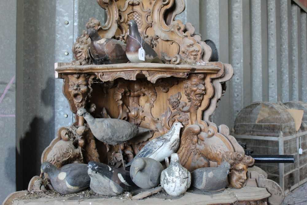 Flock of nine antique decoy pigeons