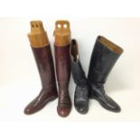 Pair gentleman's brown leather hunting boots with wooden trees and one other black leather pair