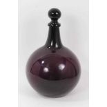 Antique aubergine glass pharmacy bottle and stopper