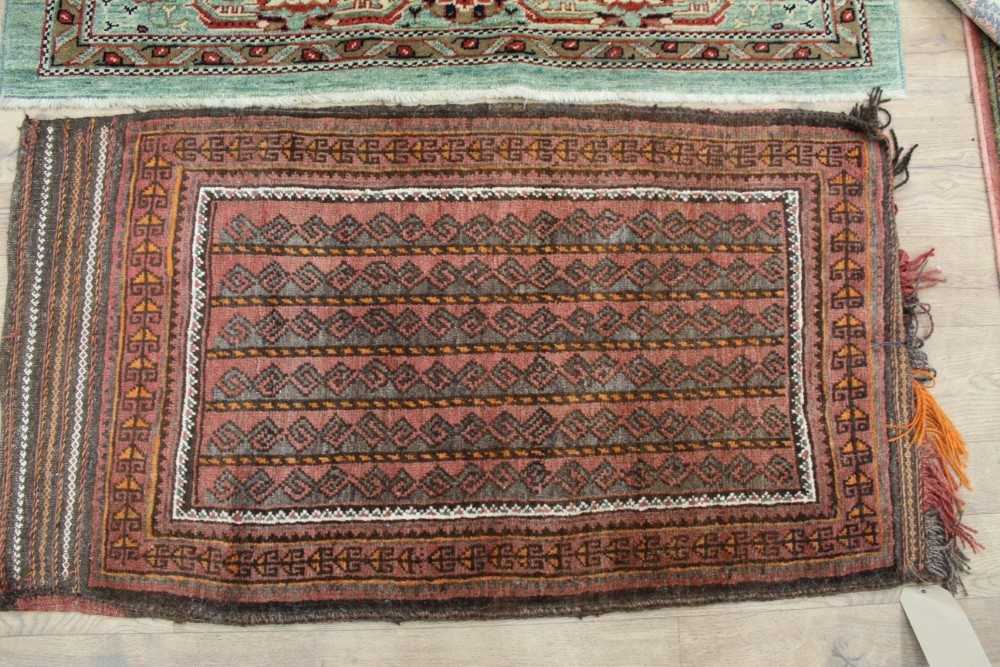 Belouche rug together with four other rugs