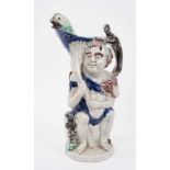 Prattware 'Bacchus & Pan' jug, circa 1800, Bacchus shown seated on a barrel, with dolphin form spout