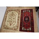 Persian style carpet together with a Turkish style carpet