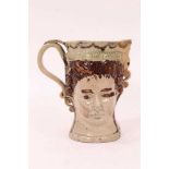 Prattware loving cup, circa 1790, modelled to two sides with masks of the Royal couple George III an