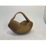 Armadillo shell shaped in the form of a basket