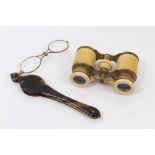 Late 19th century pair of adjustable ivory opera glasses, 11cm wide, together with a pair of Victori