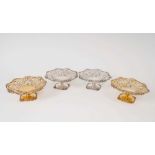 Four Edwardian pierced footed dishes by Goldsmiths and Silversmiths, London 1906/7,