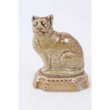 A small lead glazed stoneware model of a cat, circa 1820