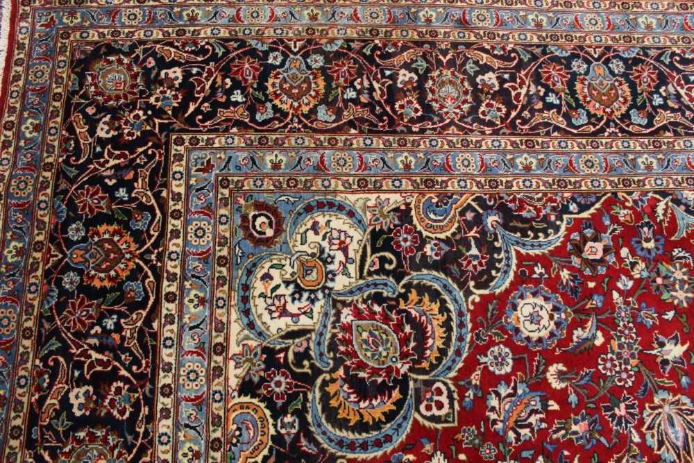 Large Kashan carpet, with meander foliate ornament on midnight blue ground in foliate meander border - Image 6 of 6