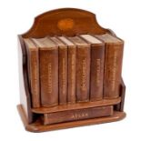 An Edwardian Inlaid mahogany book rack by Asprey