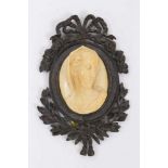 19th century Continental carved ivory cameo of a woman in a bronze frame