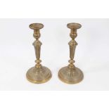 Pair of antique brass candlesticks of classical style