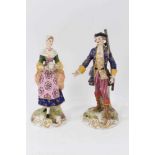 A pair of German porcelain figures of a shepherd and shepherdess, in Derby style