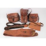 Late Victorian/Edwardian leather cartridge bag, two others, gun slip, cartridge belts and other item