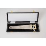 Cased Victorian silver cucumber saw with engraved Armorial crest and carved ivory handle