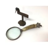 Early 20th century plated magnifying glass, together with a modern bronze sculpture