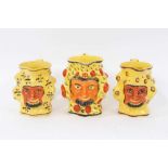 Set of three early 19th century Staffordshire canary yellow Satyr-mask jugs