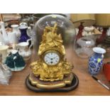 19th century French mantel clock in ornate gilded case, under glass dome,