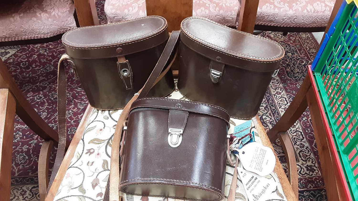 Three pairs of Ross binoculars in leather cases