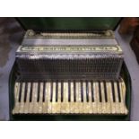 A Ballarini Guerrini 120 button piano accordion, in case, with Mother of Pearl keys