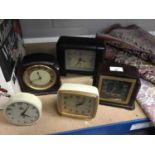 Three vintage Bakelite cased clocks and two others