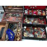 Three jewellery boxes containing costume jewellery, wristwatches and bijouterie