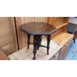Carved oak occasional table with octagonal top